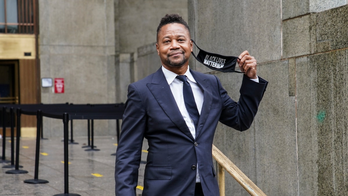 Cuba Gooding Jr. smiles as he leaves court after a hearing in his sexual misconduct case, Thursday, Aug. 13, 2020, in New York.