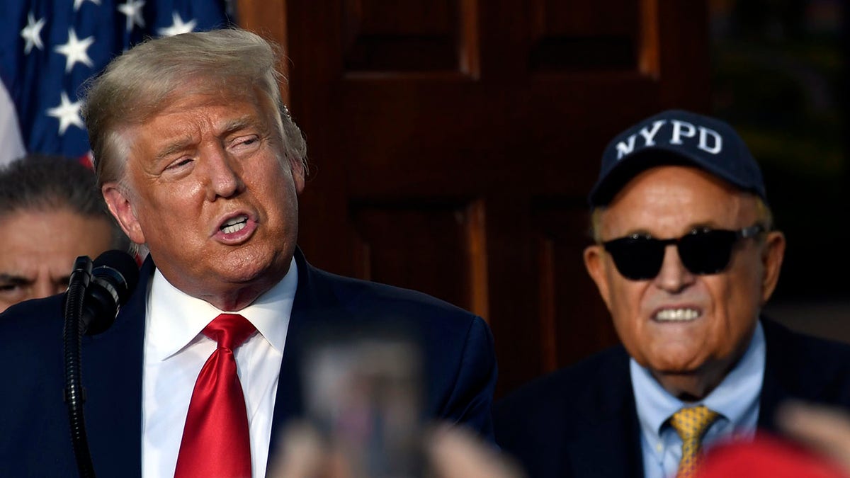 President Trump and Rudy Giuliani standing side by side