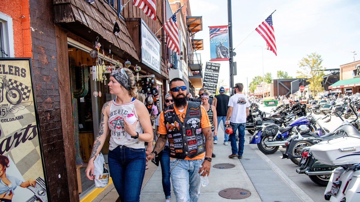 Bikers walk down Main Street during the 80th annual Sturgis Motorcycle Rally on Saturday, Aug. 15, 2020, in Sturgis, S.D. (Amy Harris/Invision/AP)