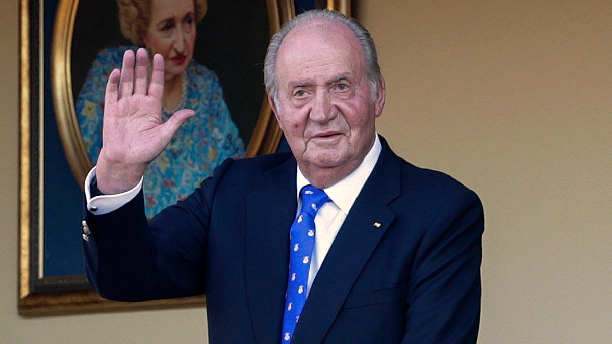 In this Sunday, June 2, 2019 file photo, Spain's former King Juan Carlos waves during a bullfight at the bullring in Aranjuez, Madrid, Spain. Spain's royal household said on Monday, Aug. 17, 2020, that Juan Carlos is in the United Arab Emirates, resolving a mystery over his whereabouts that has swirled in Spain since he announced he was leaving the country amid a growing financial scandal. (AP Photo/Andrea Comas, File)