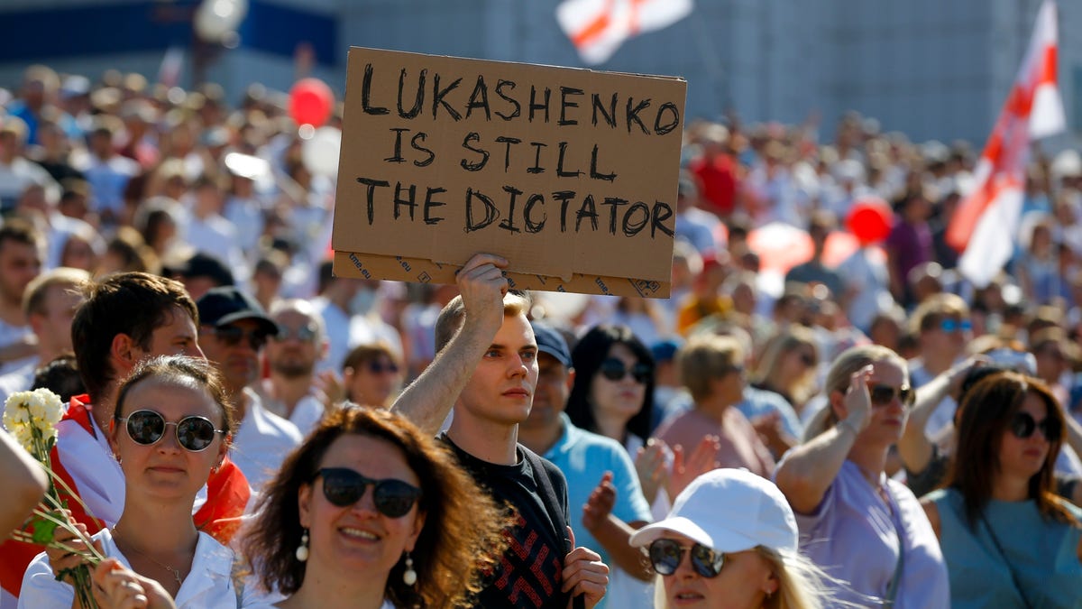 In this Sunday, Aug. 16, 2020 file photo Belarusian opposition supporters rally in the center of Minsk, Belarus. The EU believes that the results of the Aug. 9 polls, which handed President Alexander Lukashenko his sixth term with 80% of the vote, "have been falsified," and the 27-nation bloc is preparing a list of Belarus officials who could be blacklisted from Europe over their roles. (AP Photo/Sergei Grits, File)