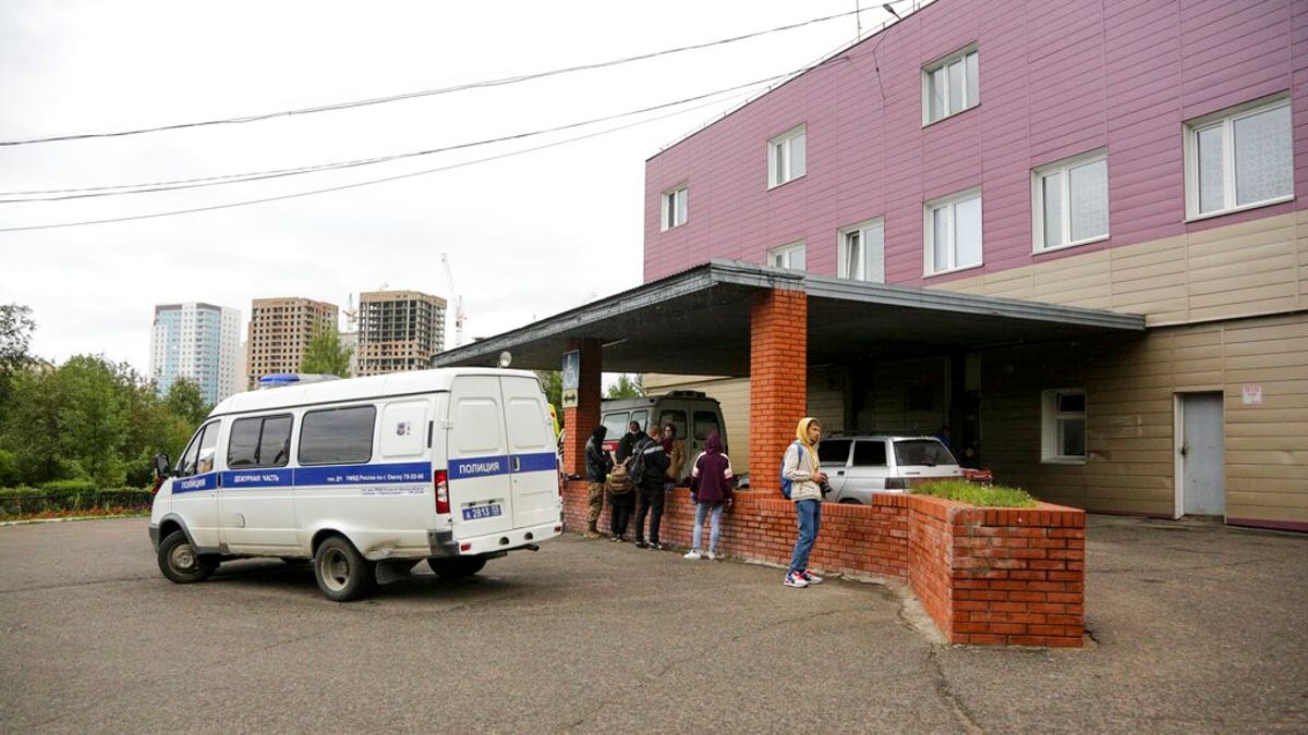 An ambulance is parked outside the hospital intensive care unit where Alexei Navalny is hospitalized in Omsk, Russia, Thursday, Aug. 20, 2020. 