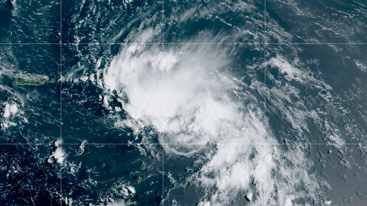 This satellite image released by the National Oceanic and Atmospheric Administration (NOAA) shows Tropical Storm Laura in the North Atlantic Ocean, Friday, Aug. 21, 2020. Laura formed Friday in the eastern Caribbean and forecasters said it poses a potential hurricane threat to Florida and the U.S. Gulf Coast. A second storm also may hit the U.S. after running into Mexico's Yucatan Peninsula. (NOAA via AP)