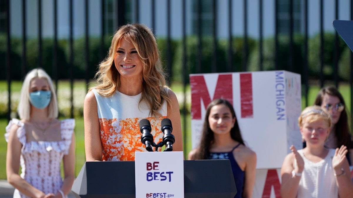 First lady Melania Trump visits an exhibit of artwork by young Americans in celebration of the 100th anniversary of the 19th amendment which afforded the vote to women, at the White House in Washington, Monday, Aug. 24, 2020. (AP Photo/J. Scott Applewhite)