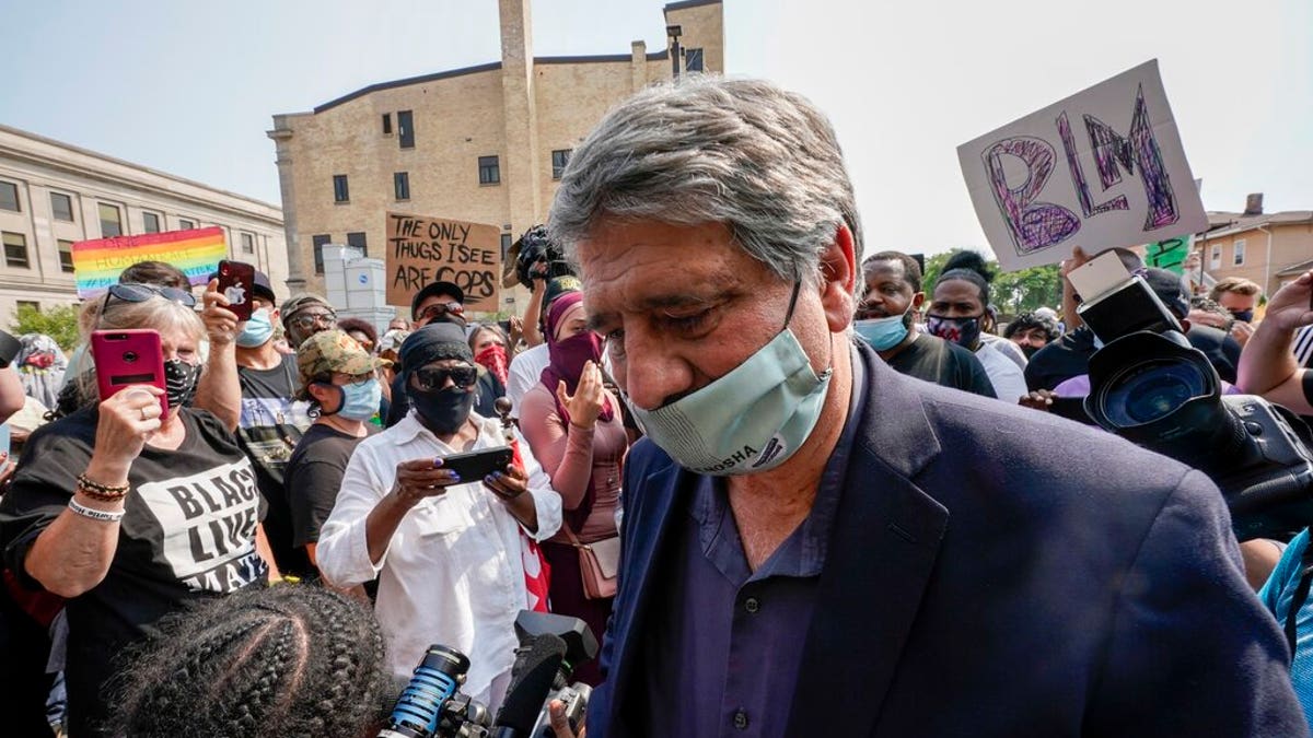 Kenosha Mayor John Antaramian walking away after trying to speak to protesters Monday in his city.