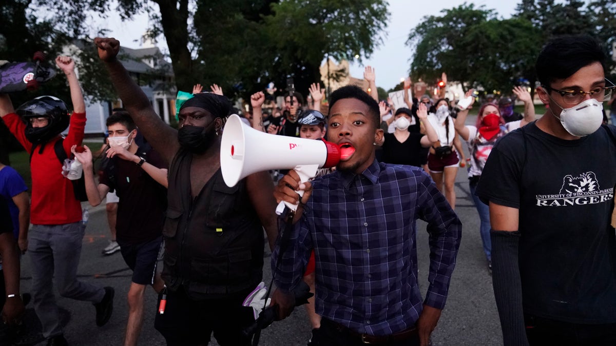 Protesters march against the Sunday police shooting of Jacob Blake in Kenosha, Wis., Wednesday, Aug. 26, 2020. (Associated Press)