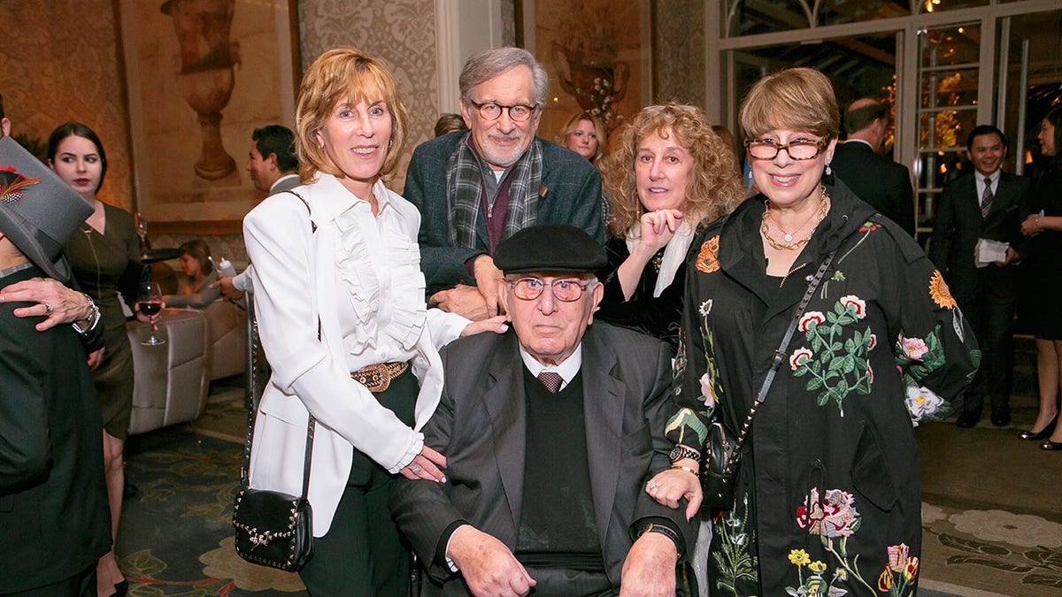 Arnold Spielberg is surrounded by his children, Nancy Spielberg, Steven Spielberg, Anne Spielberg and Sue Spielberg, at the celebration of his 100th birthday in 2017.
