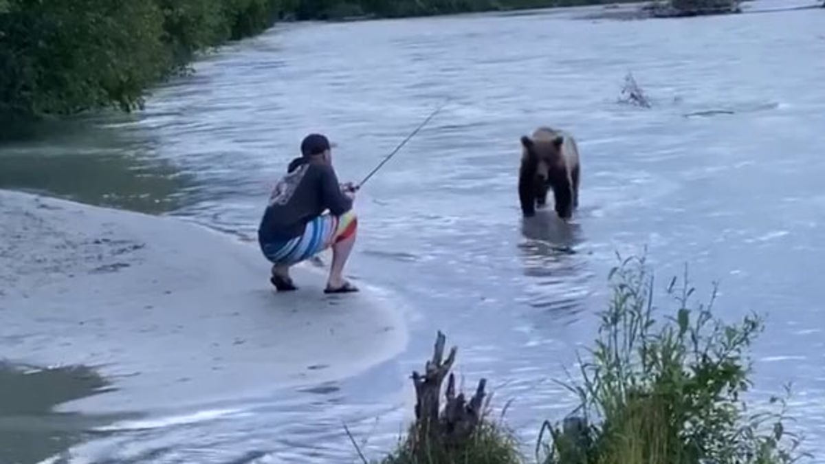 "Caught a sockeye and a bear!" the fisherman joked on Facebook.