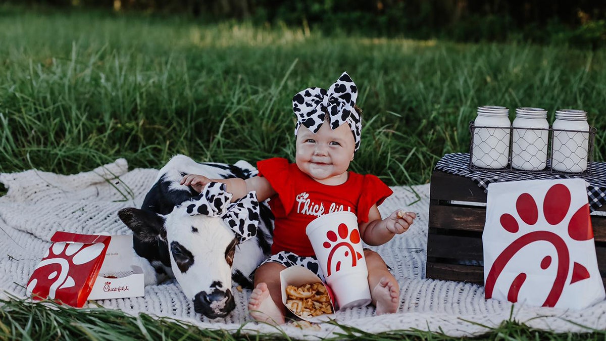 Chick-fil-A-themed photoshoot features a rescue calf and a baby having an adorable picnic. (Tori Walker Photography LLC) 