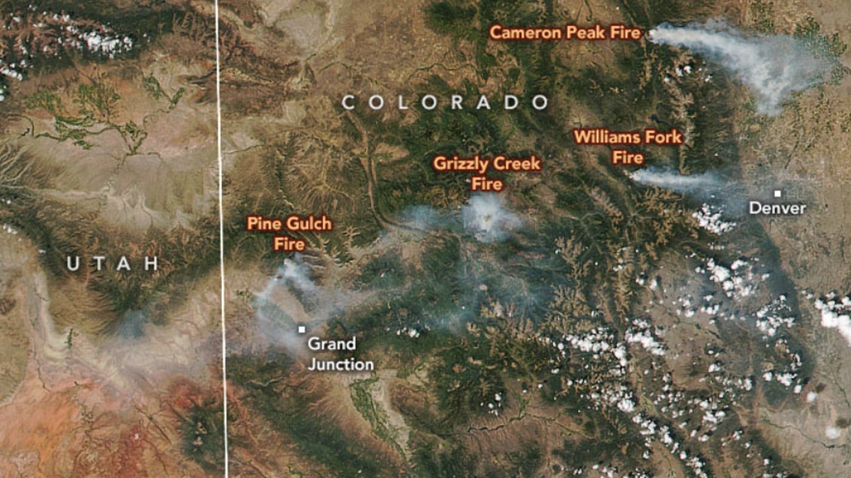 Four major wildfires can be seen burning across Colorado in this satellite image from Saturday.
