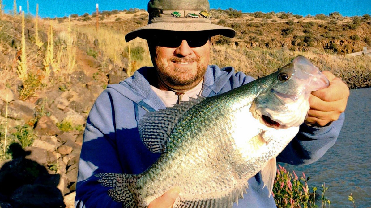 Jon Urban and his 17-inch black crappie fish, a record catch in the Gem State.