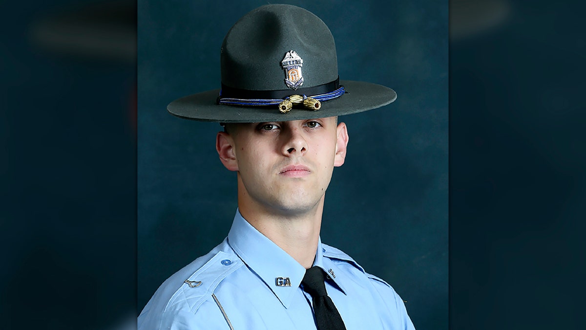 In this undated photo released by the Georgia Department of Public Safety, State trooper Jacob Gordon Thompson is seen in an official portrait. (Georgia Department of Public Safety via AP)