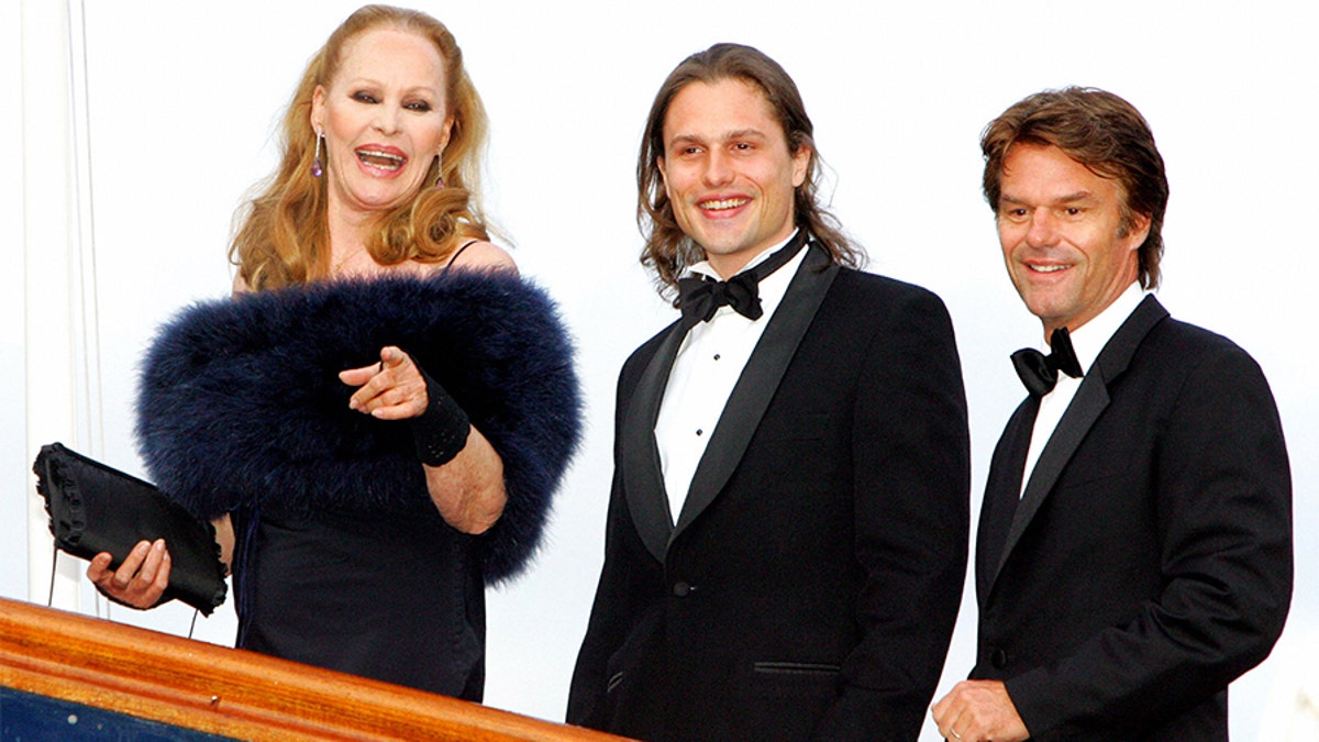 Swiss Hollywood film star Ursula Andress (L) arrives with her son Dimitri Hamlin (C) and former partner Harry Hamlin at The Royal Yacht Britannia in Edinburgh, Scotland, 18th May 2006, to take part in a special party to celebrate her 70th birthday. Andress was the original 'Bond girl' having become famous for her role as Honey Rider in the James Bond film, 'Dr. No.'