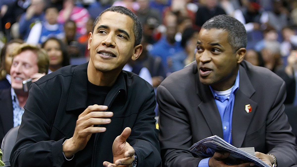 President Barack Obama talks with his friend Marty Nesbitt at the Chicago Bulls vs Washington Wizards basketball during their game played at the Verizon Center in Washington, D.C., Friday, February 27, 2009. (Photo by Harry E. Walker/MCT/Tribune News Service via Getty Images)