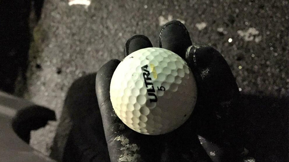 Porland police said they recovered this golf ball after it was thrown through a van window during a riot outside a precinct early Saturday.