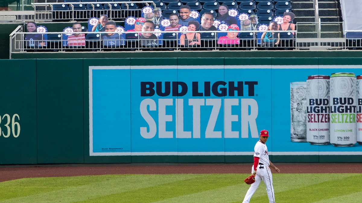 Washington Nationals left fielder Juan Soto walks near cut-outs with number 22 on the bleacher during the first inning of a baseball game against the New York Mets in Washington, Wednesday, Aug. 5, 2020. (AP Photo/Manuel Balce Ceneta)