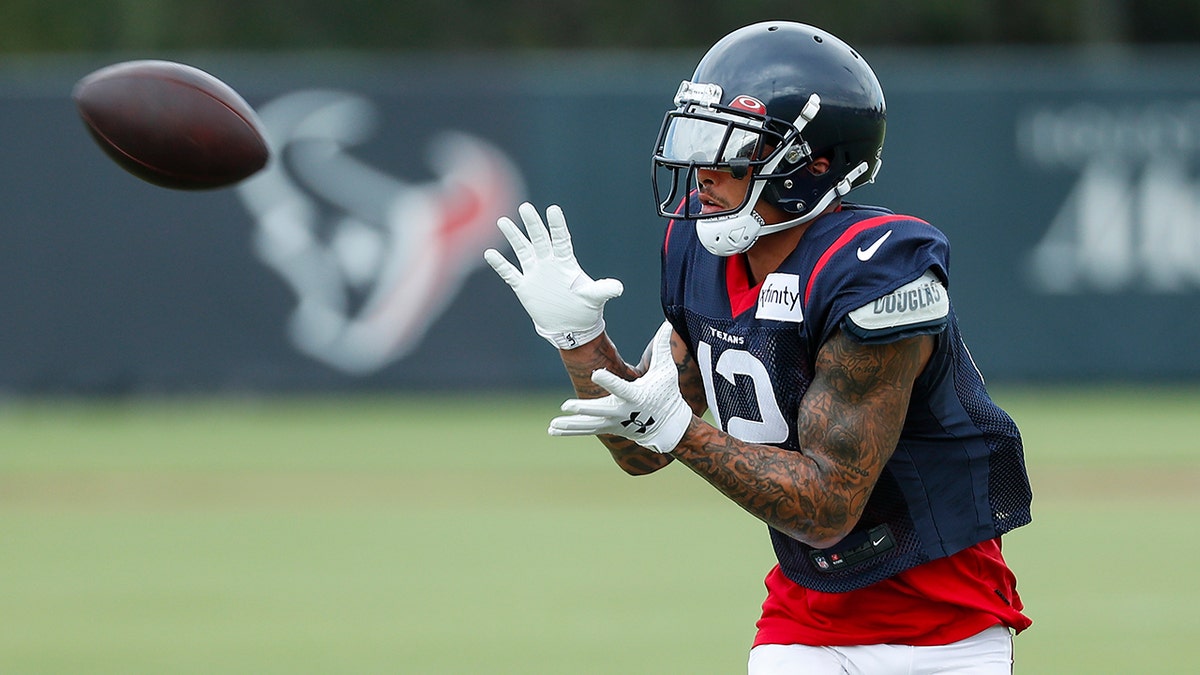 Houston Texans wide receiver Kenny Stills reaches out to make a catch during an NFL training camp football practice Monday, Aug. 24, 2020, in Houston. (Brett Coomer/Houston Chronicle via AP, Pool)