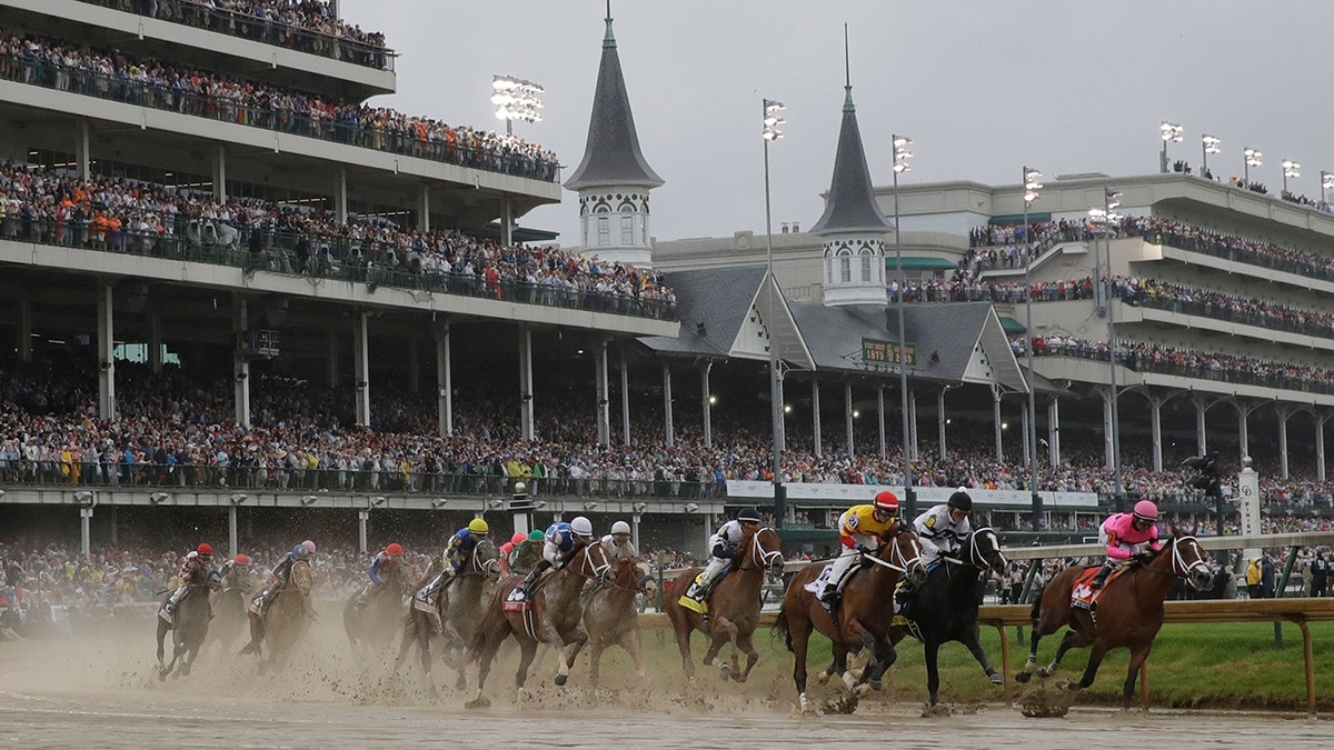 FILE - In this Saturday, May 4, 2019 file photo, Flavien Prat on Country House, third from right, races against Luis Saez on Maximum Security, right, during the 145th running of the Kentucky Derby horse race at Churchill Downs in Louisville, Ky. Maximum Security finished first but was disqualified. The fastest two minutes in sports will also be the quietest in Kentucky Derby history. (AP Photo/Darron Cummings, File)