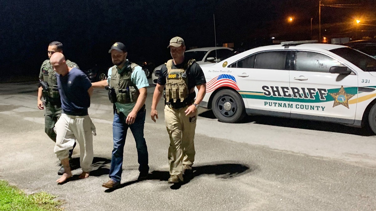 Investigators took Mark Wilson, 30, in custody Thursday night for the deaths of two brothers, 14 and 12.