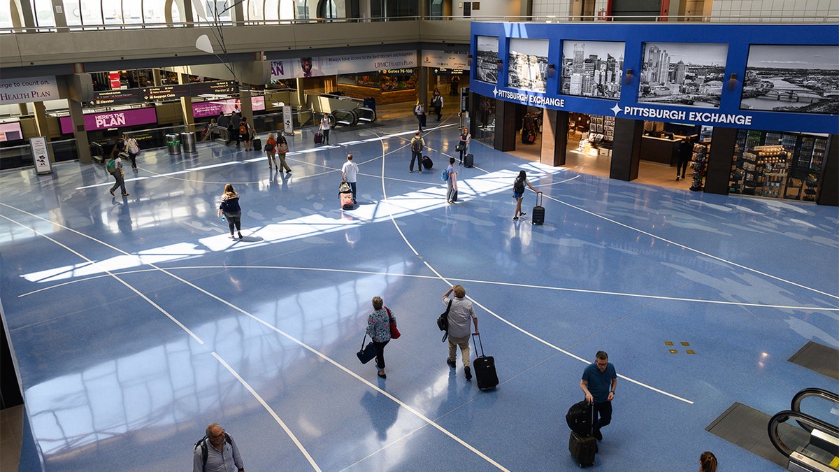 Passengers walk through Pittsburgh International Airport. (Justin Merriman/Bloomberg via Getty Images)