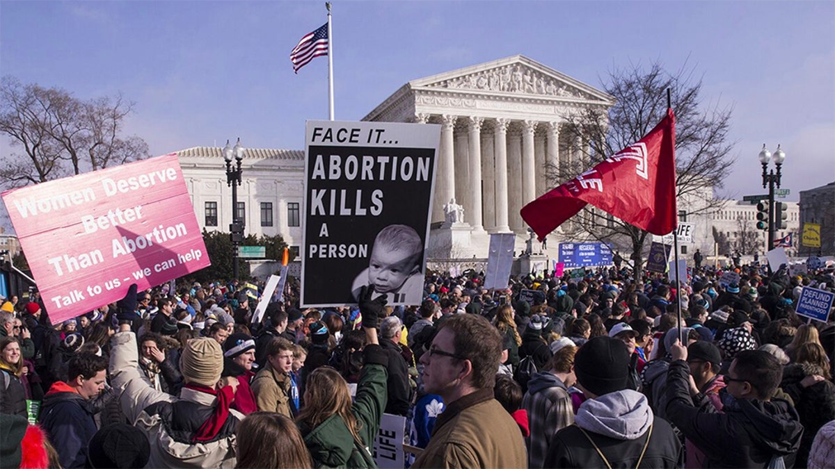 Pro-life advocates march past the U.S. Supreme Court during the 46th annual March for Life in Washington, D.C., U.S., on Jan. 18, 2019. People nationwide gathered in Washington, D.C., for the annual rally against abortion, which that year included a video message from then-President Donald J. Trump and an address by then-Vice President Mike Pence. Photographer: Zach Gibson/Bloomberg via Getty Images