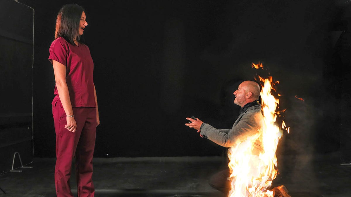 In a dramatic moment, stunt actor Riky Ash asked Katrina Dobson to marry him as flames flew up his back and legs.