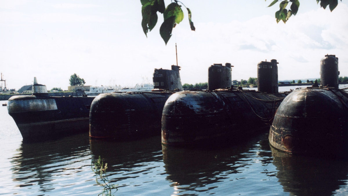 File photo - Unidentified Russian submarines are moored before being decommissioned at naval base July 2000.