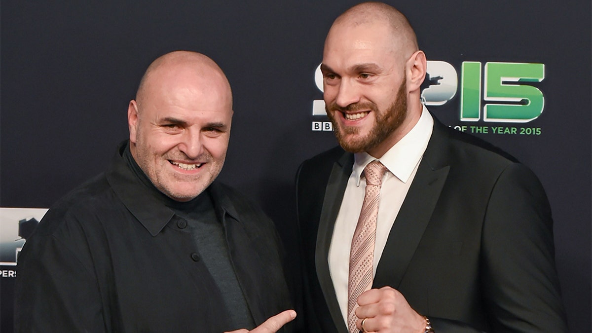 Boxer Tyson Fury and his father, John, arrive to BBC Sports Personality of the Year 2015 at the Titanic Belfast, Titanic Quarter, Olympic Way, Belfast, Co Antrim. Picture credit: Stephen McCarthy / SPORTSFILE 