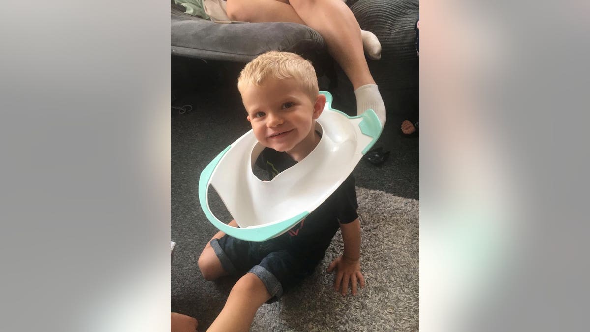 Callum Souch had to be rescued by firefighters after getting his head stuck in a toilet seat. (Credit: SWNS)