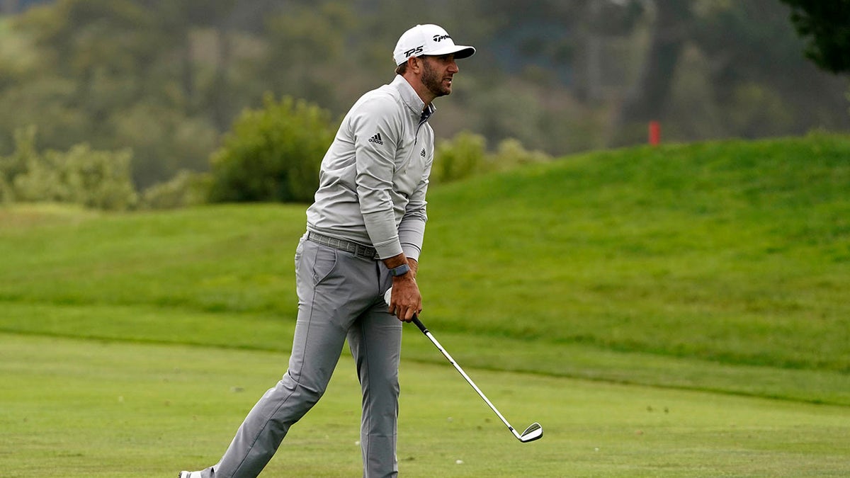 Dustin Johnson hits from the fairway on the 18th hole during the third round of the PGA Championship golf tournament at TPC Harding Park Saturday, Aug. 8, 2020, in San Francisco. (Associated Press)