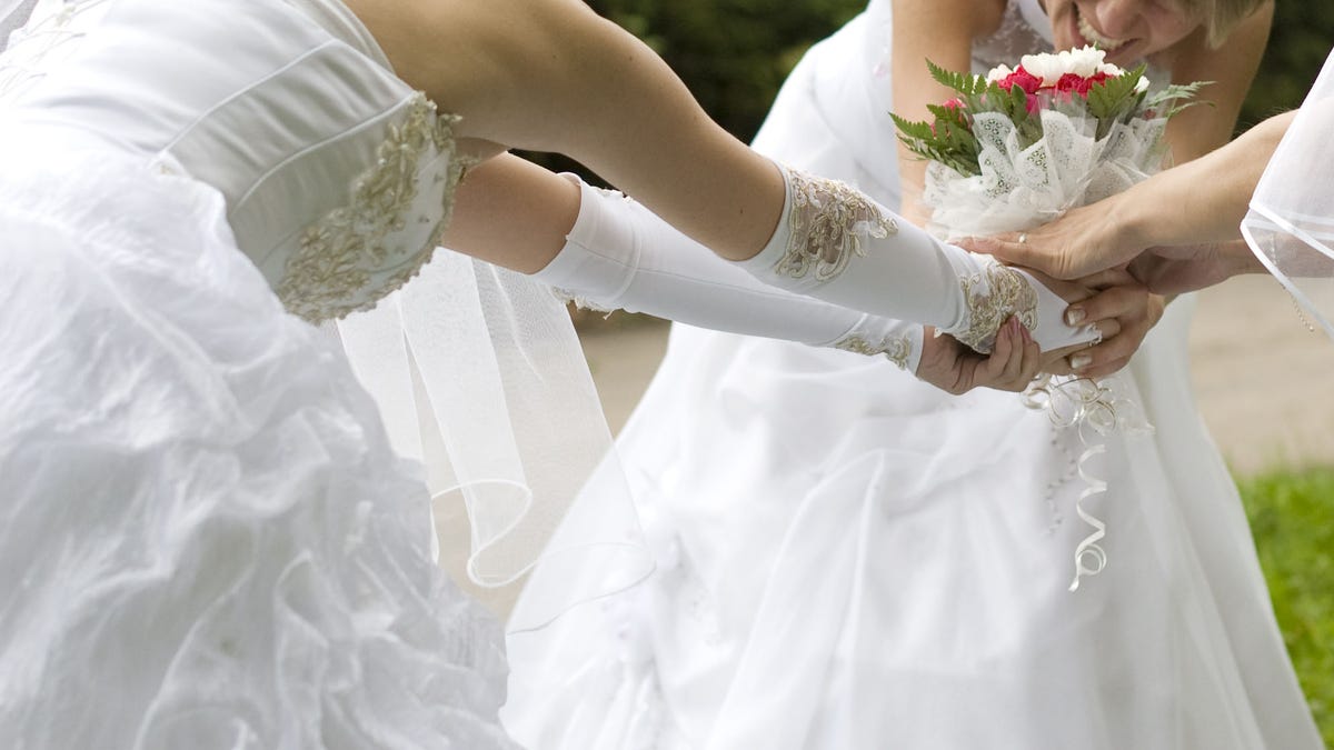 Brides fight for a bouquet.