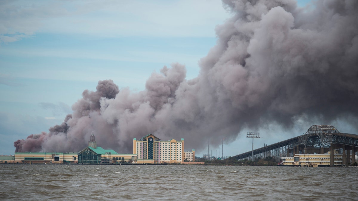 Smoke rises from a burning chemical plant after the passing of Hurricane Laura in Lake Charles, Louisiana on August 27, 2020.