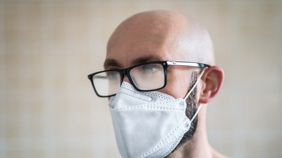 Face masks trap the breath and foster humidity so glasses wearers may have noticed that wearing a face mask can cause the lenses to fog. (iStock)
