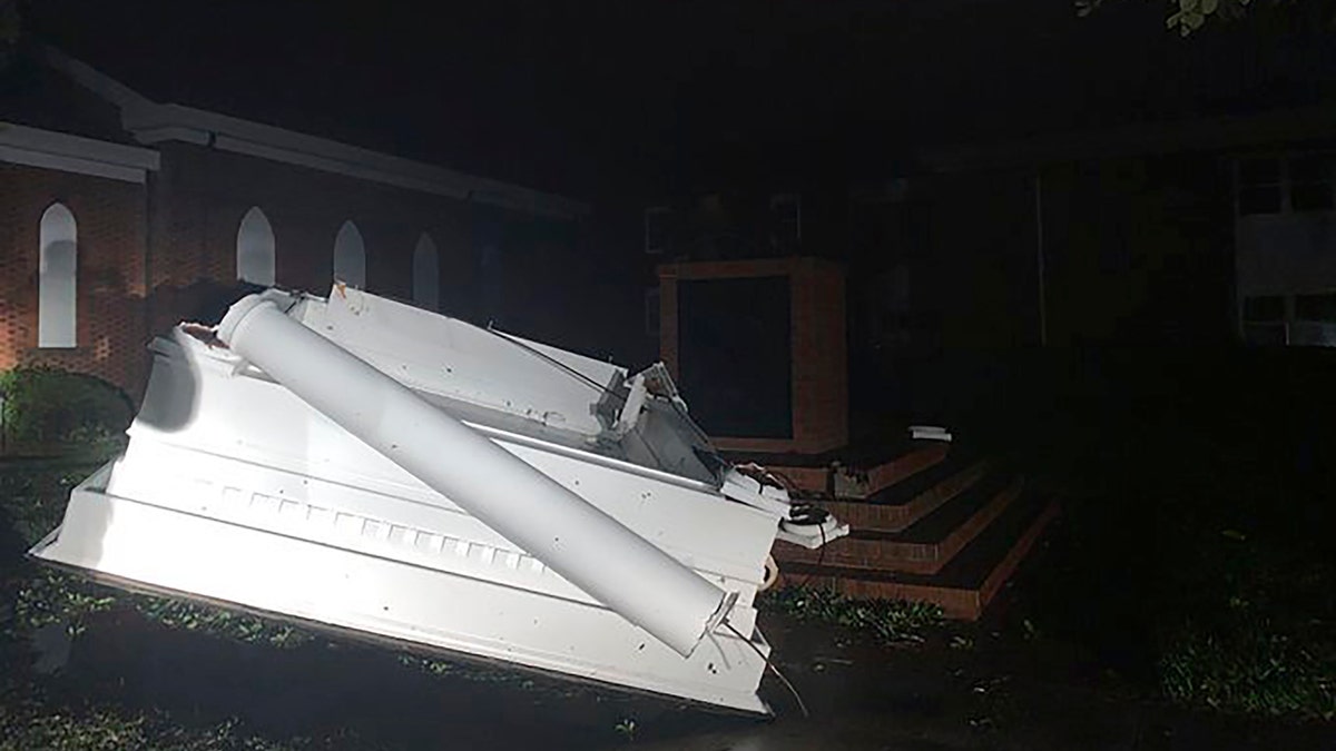 A bell tower toppled outside of Southport Baptist Church in Southport, N.C. as hurricane Isaias moved through North Carolina on Tuesday, Aug. 4, 2020.