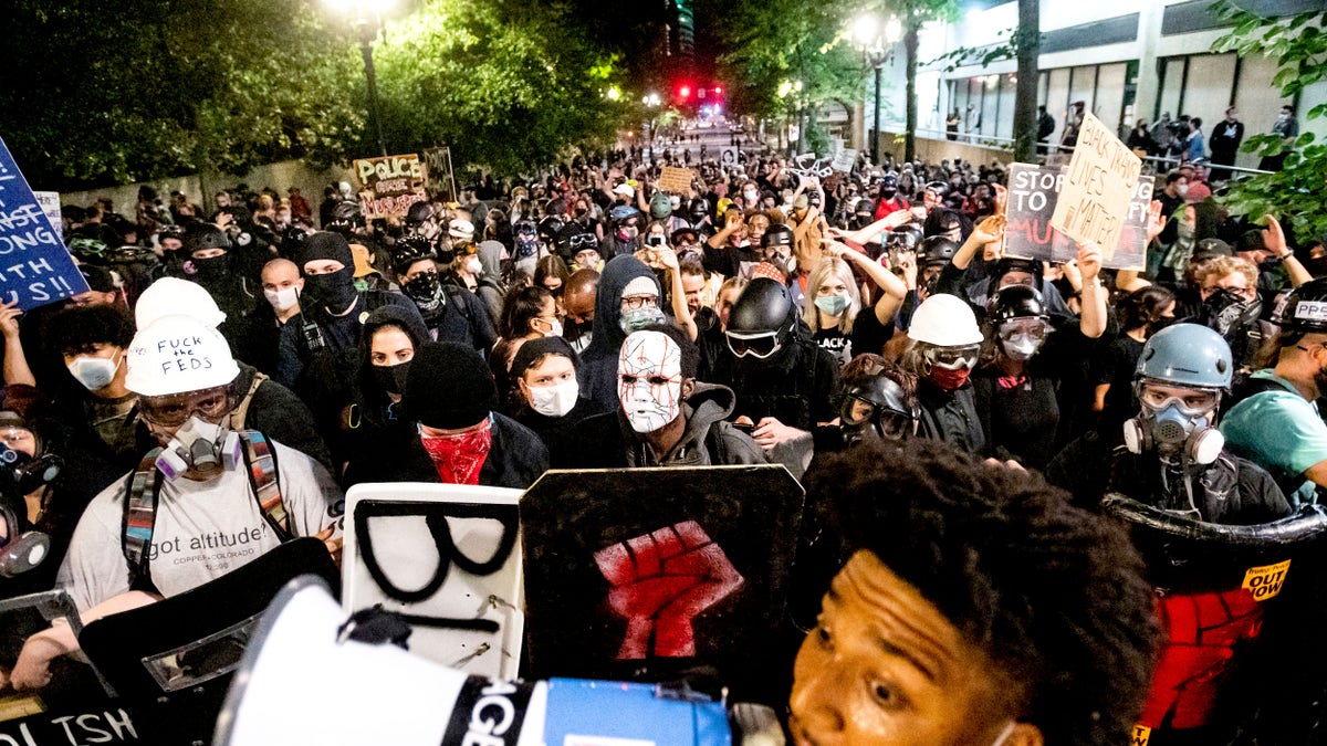 Black Lives Matter protesters march through Portland after rallying at the Mark O. Hatfield United States Courthouse on Sunday. (AP)