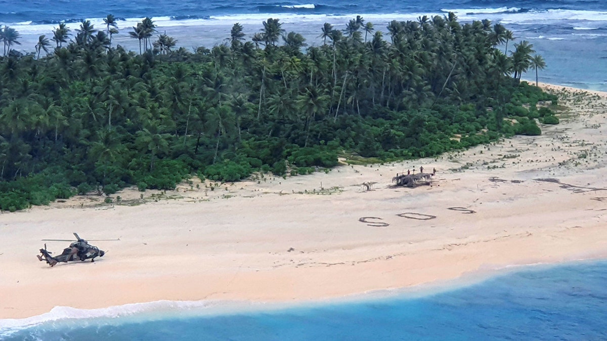 In this photo provided by the Australian Defence Force, an Australian Army ARH-90 Tiger Helicopter lands on Pikelot Island in the Federated States of Micronesia where three men were found safe and healthy on Sunday, Aug. 2, 2020, after missing for three days. (Australian Defense Force)