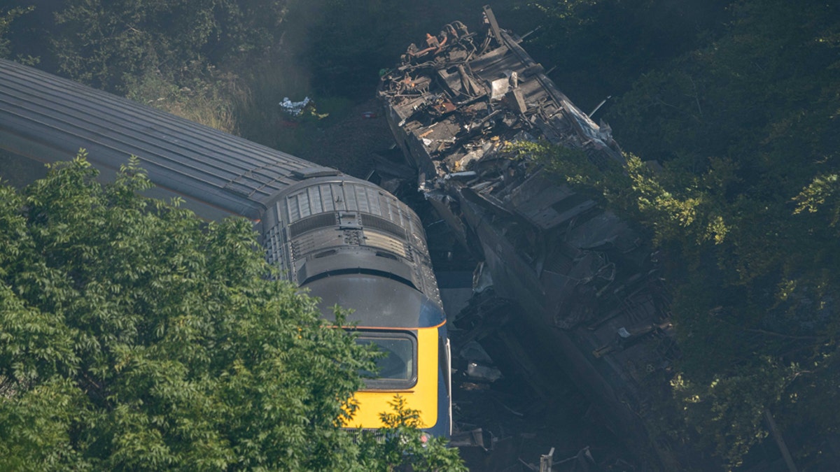 Derailed carriages are seen at the scene of a train crash near Stonehaven in northeast Scotland on August 12, 2020. (Photo by Michal Wachucik / AFP via Getty Images)