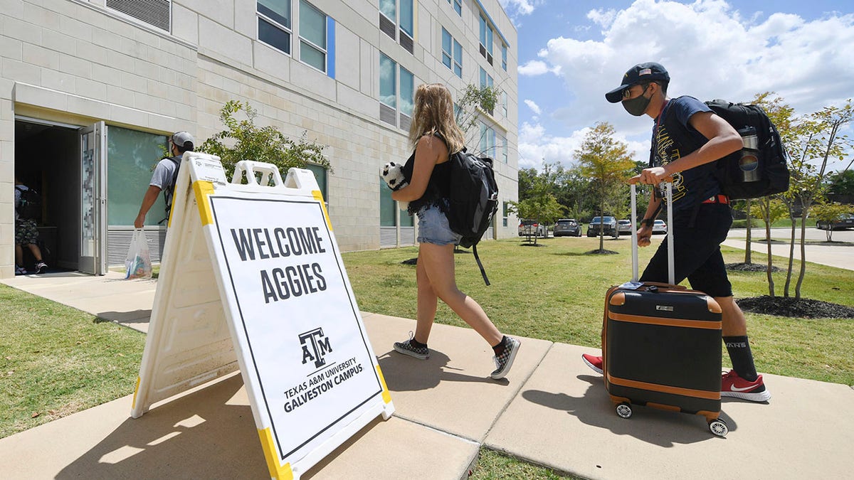 FILE - Evacuated students from Texas A&amp;M University at Galveston are welcomed at Aloft College Station on Tuesday, Aug. 25, 2020, in College Station, Texas. Hurricane Laura is expected to make landfall late Wednesday or early Thursday. (Laura McKenzie/College Station Eagle via AP)