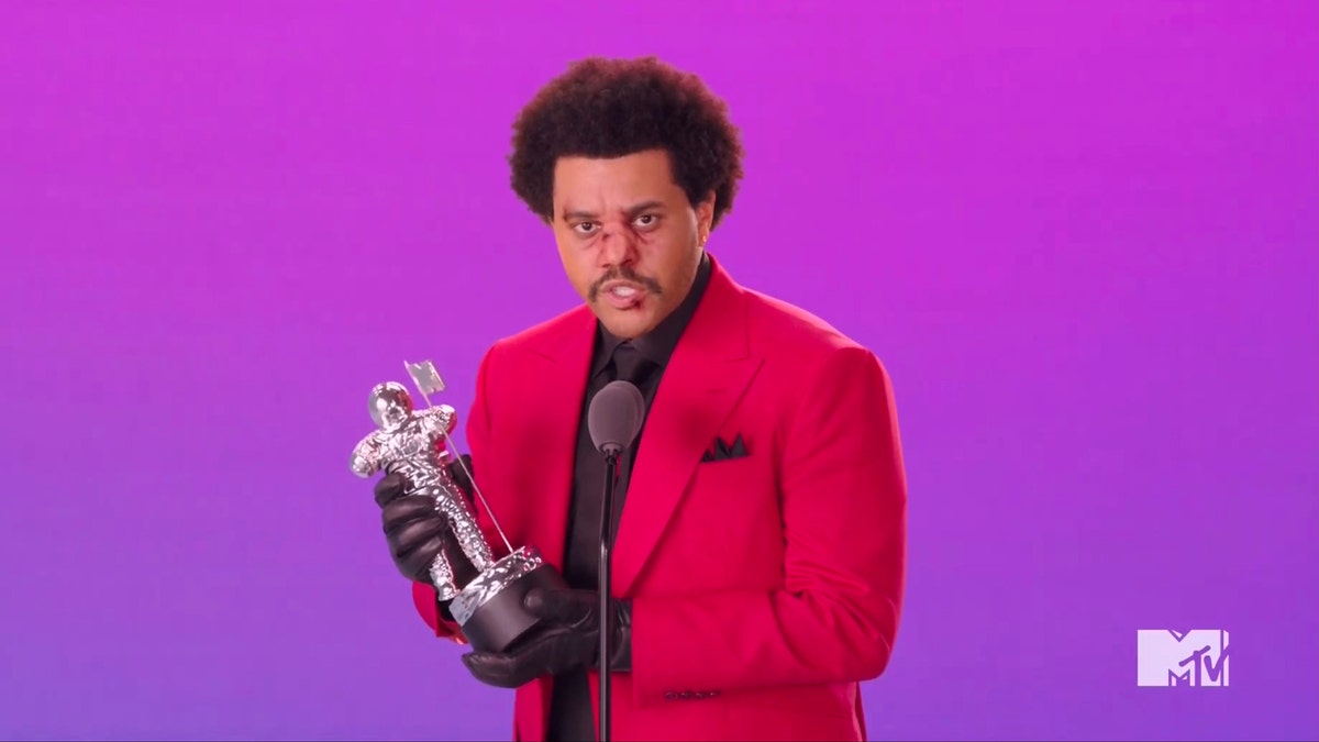 In this video grab issued Sunday, Aug. 30, 2020, by MTV, The Weeknd accepts the award for best R&amp;B video for "Blinding Lights" during the MTV Video Music Awards. (MTV via AP)