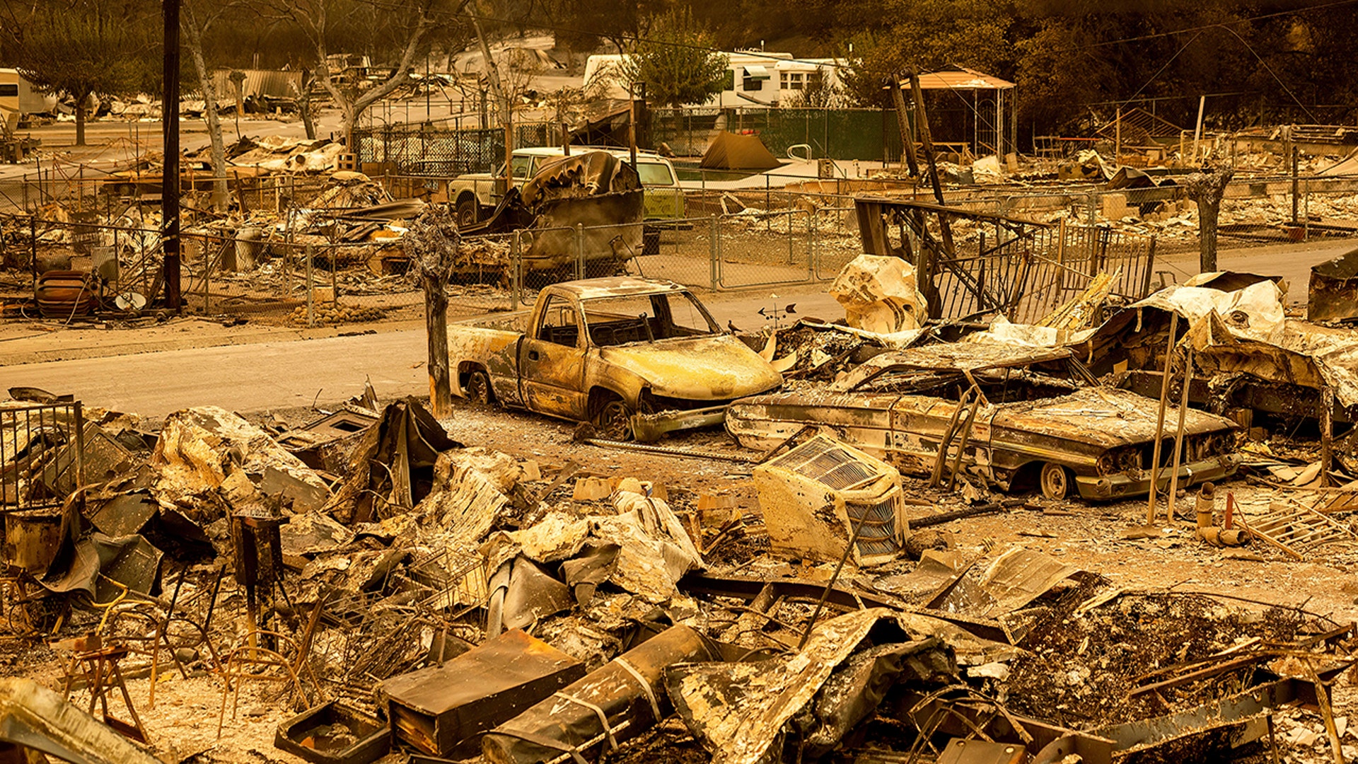 Scorched homes and vehicles fill Spanish Flat Mobile Villa following the LNU Lightning Complex fires in Napa County, Calif., Aug. 20, 2020. 