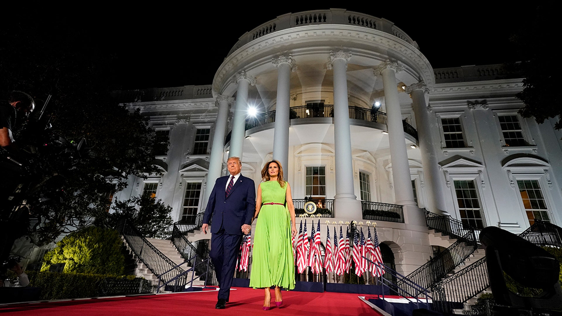 President Donald Trump and first lady Melania Trump arrive for his acceptance speech to the Republican National Committee Convention on the South Lawn of the White House, in Washington, Aug. 27, 2020. 