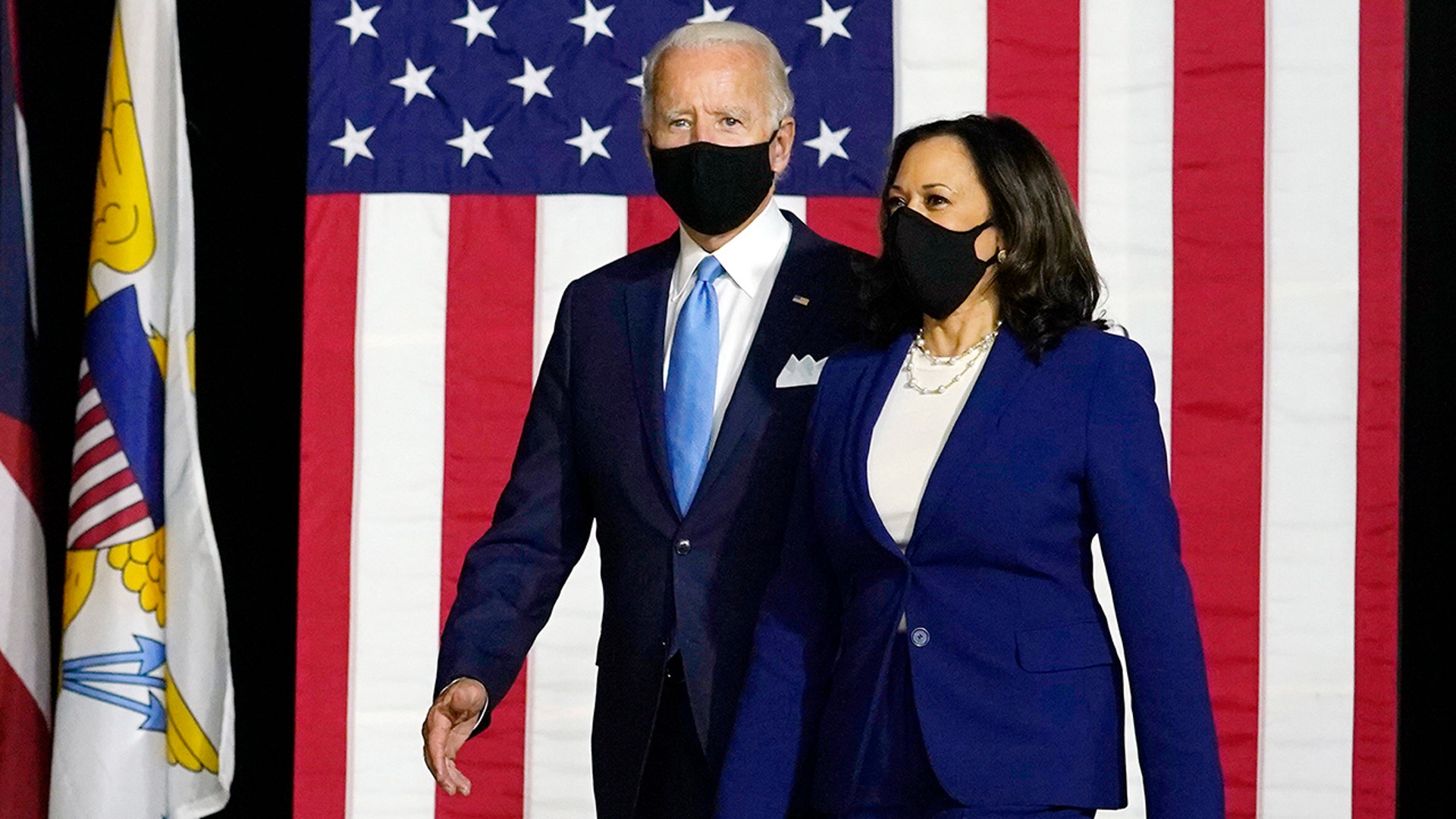 Democratic presidential candidate Joe Biden and his running mate Sen. Kamala Harris arrive to speak at a news conference in Wilmington, Delaware, Aug. 12, 2020.