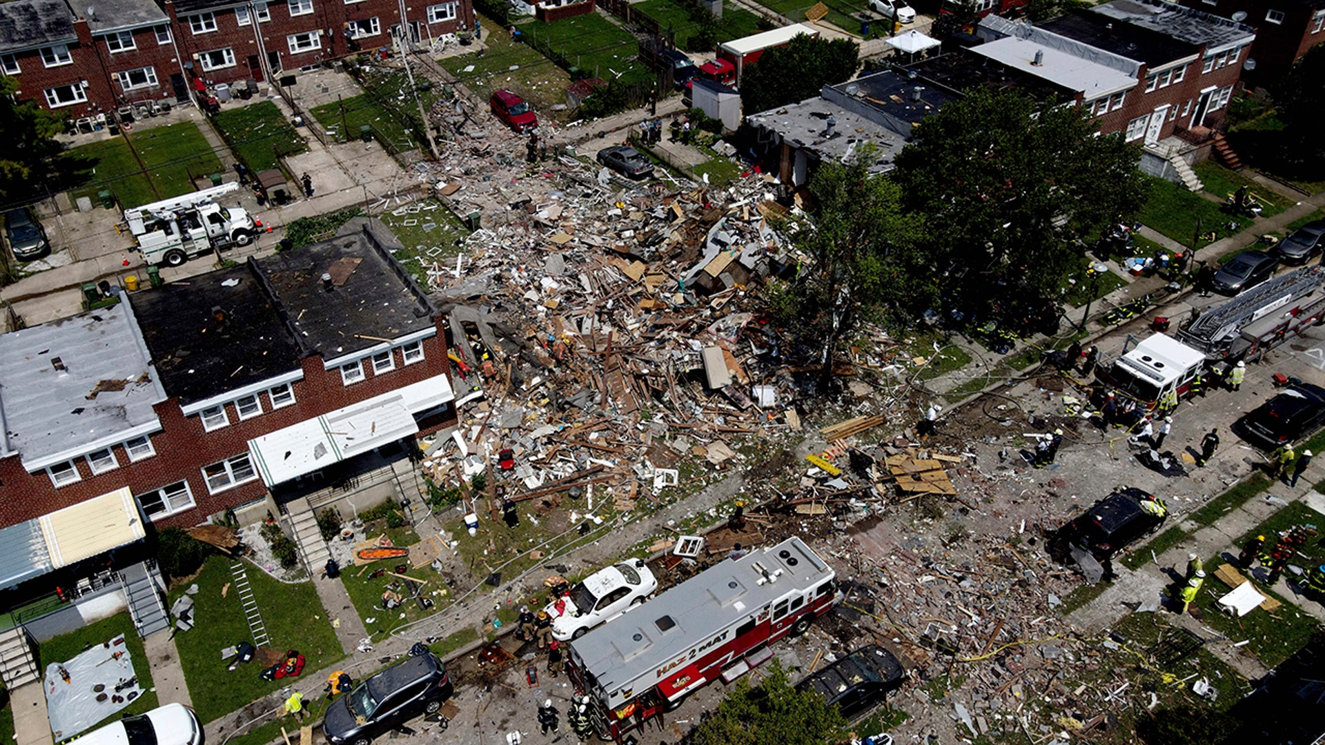 Debris and rubble cover the ground in the aftermath of an explosion in Baltimore, Aug. 10, 2020.