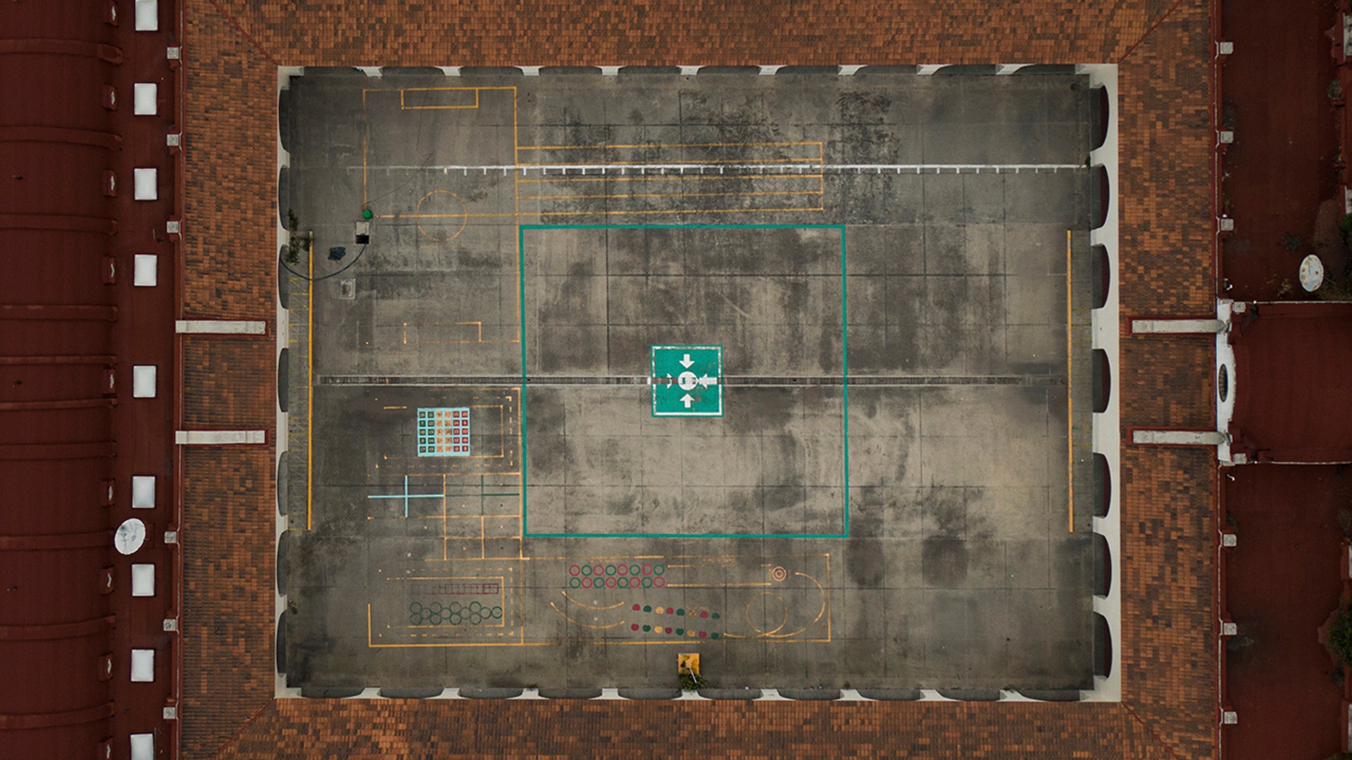 A schoolyard sits empty at the Benito Juarez school, closed amid the coronavirus virus as students return to online learning in Mexico City, Aug. 24, 2020. 