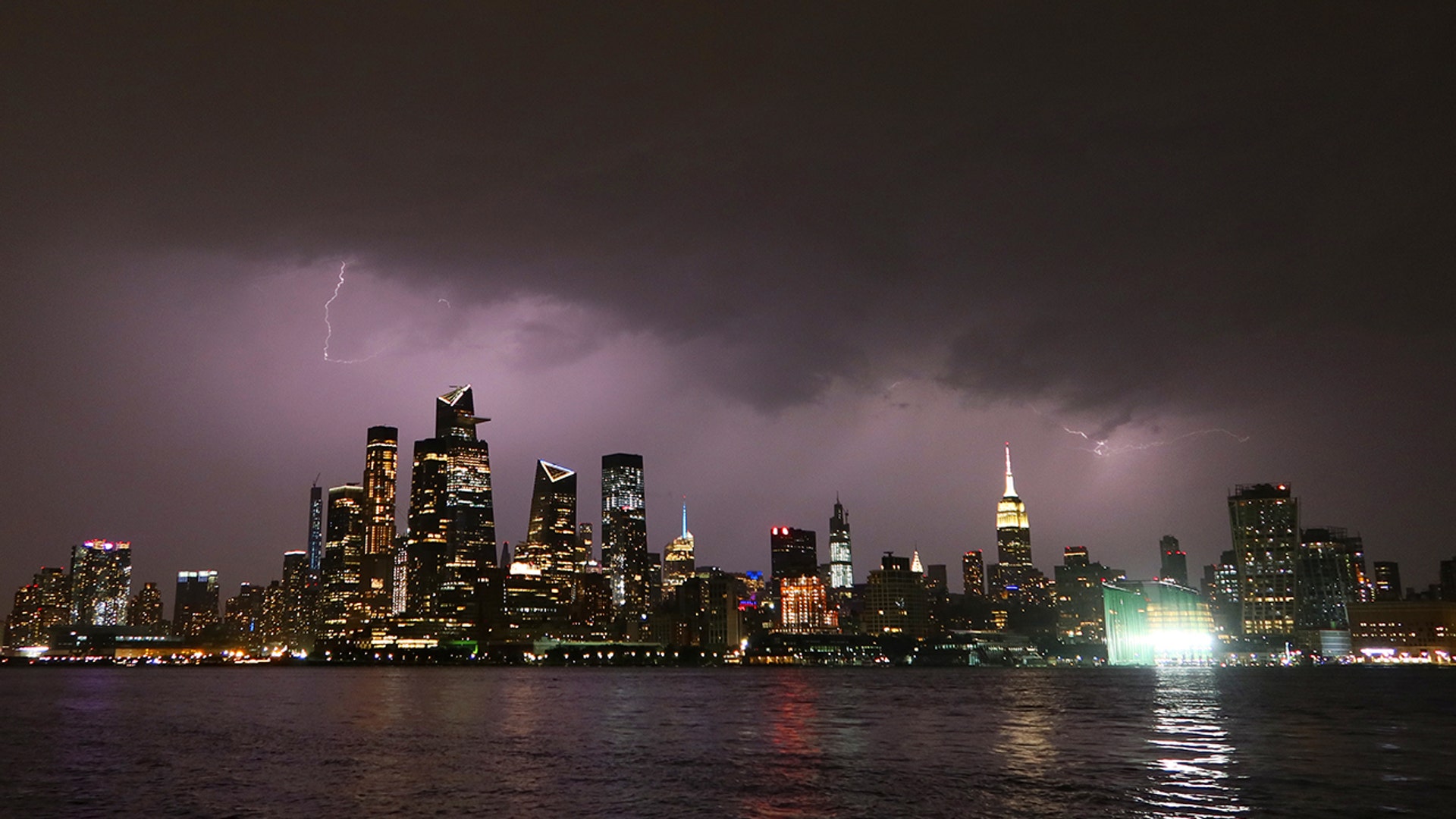 Lightning lights up the sky behind Midtown Manhattan and the Empire State Building ahead of the expected arrival of Hurricane Isaias in New York City, Aug. 3, 2020 