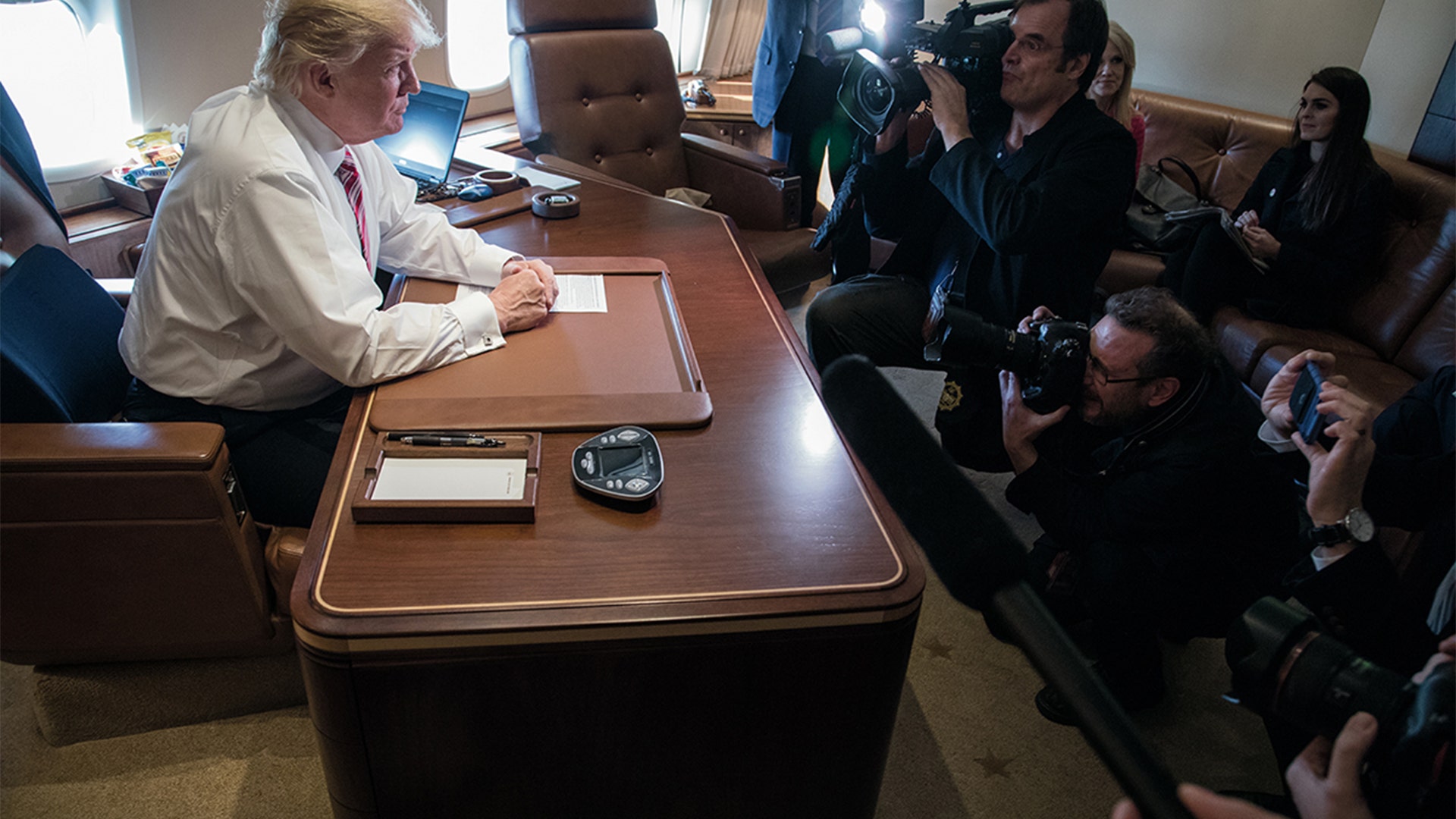 January 26, 2017: Talking to members of the press in the President’s office aboard Air Force One