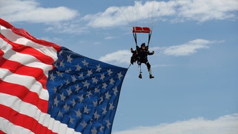 Double-amputee veteran skydives above Sturgis rally with giant US flag, Trump 2020 parachute