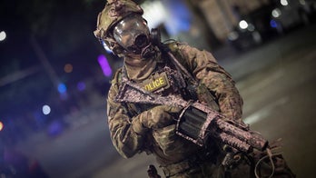 The Department of Homeland Security says it will replace the military-style uniforms worn by its agents