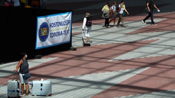 Munich Airport police search woman's wooden box, find husband's bones