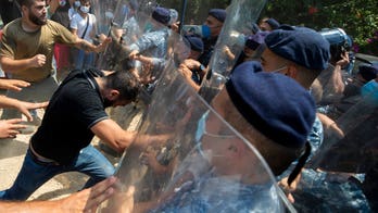 Lebanese authorities fire tear gas as protesters chant 'Revolution' after Beirut blast